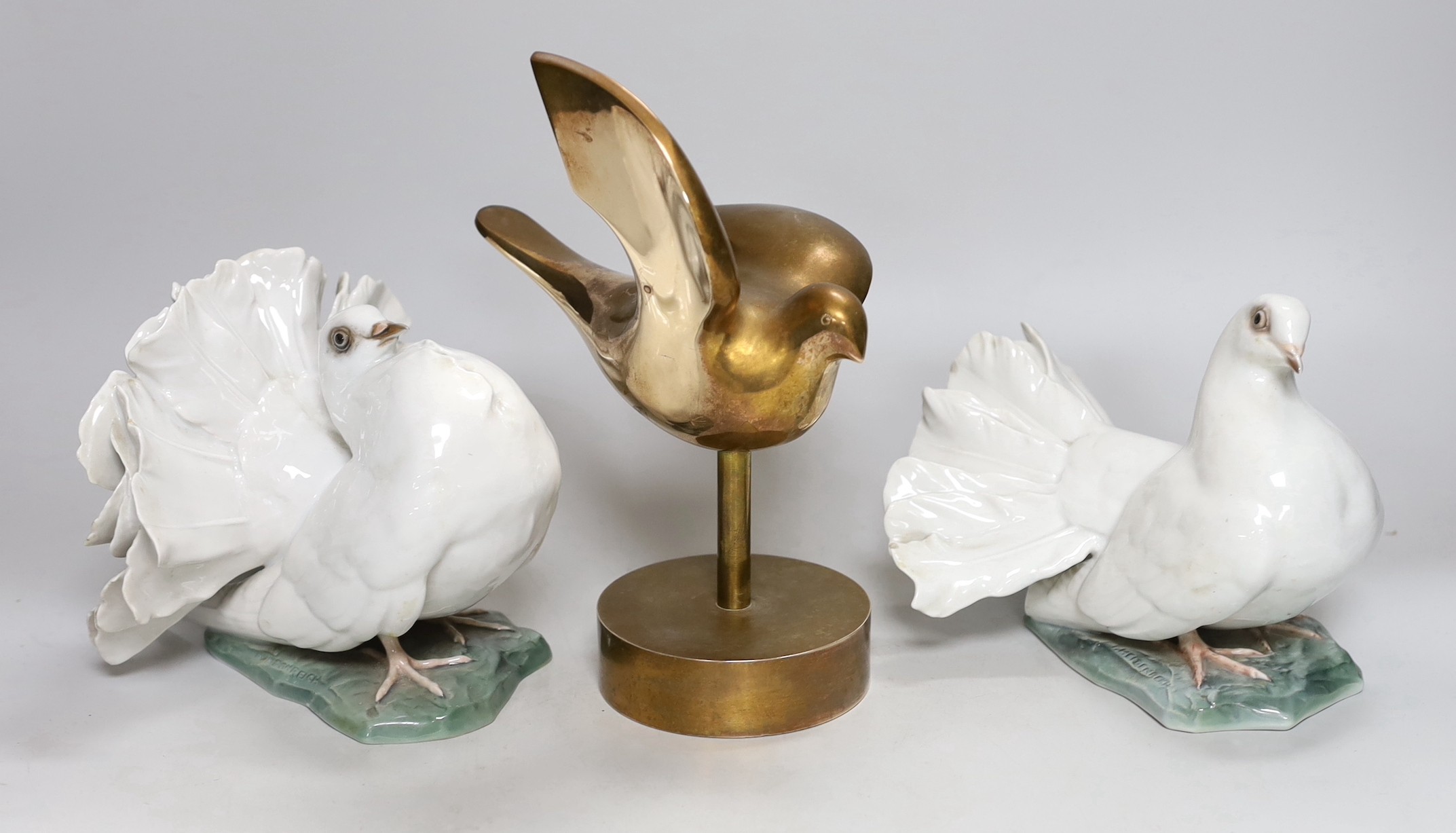 A pair of Rosenthal models of doves and a Swiss bronze dove on stand, bronze dove 23cms high